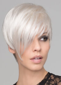 This short, asymmetrical boy cut is soft, with a tapered neckline and angled fringe