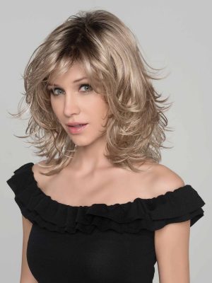 The Ocean wig by Ellen Wille is a beautiful mid-length style wig with light waves. It is shown in sandy blonde rooted.